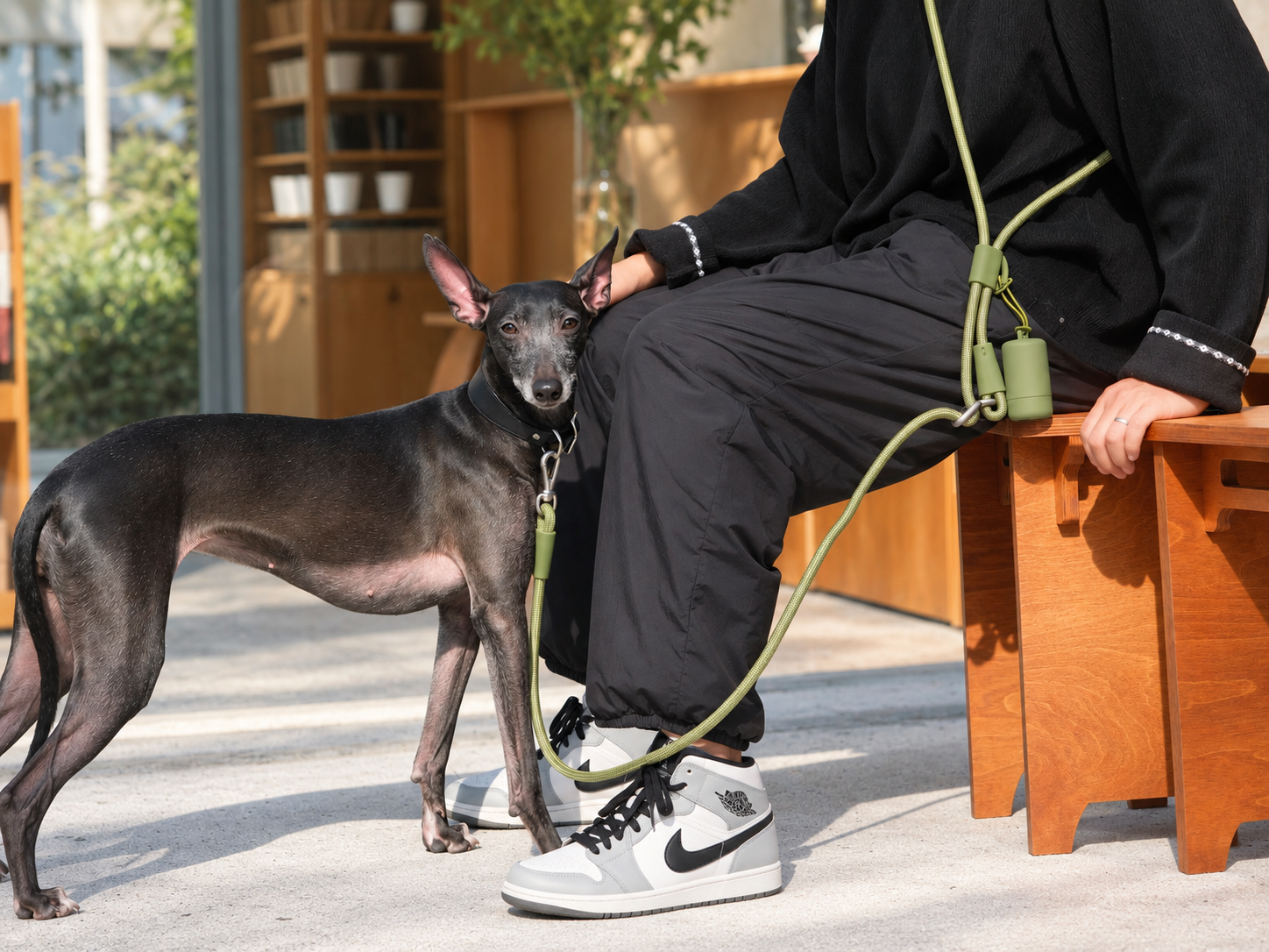 Green Mayfair Pets rope lead worn hands-free alongside a dog