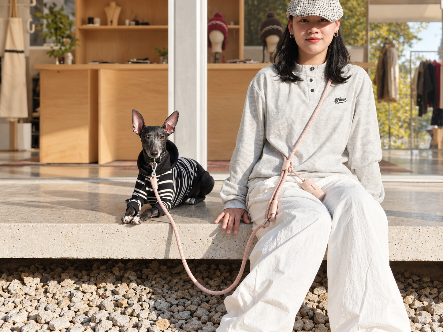 Pink Mayfair Pets multi-way rope lead worn crossbody for a hands-free dog walk